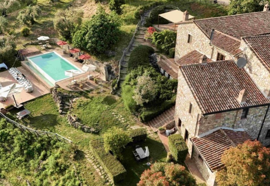 Aerial view of Farmhouse Fontanelle, its terraces and infinity pool